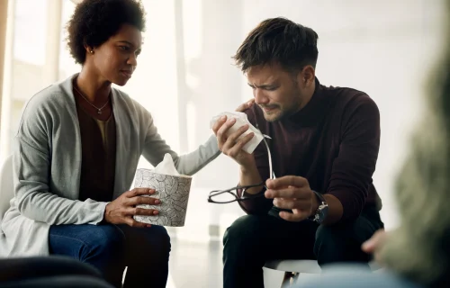 sad-man-crying-while-talking-about-his-issues-group-therapy